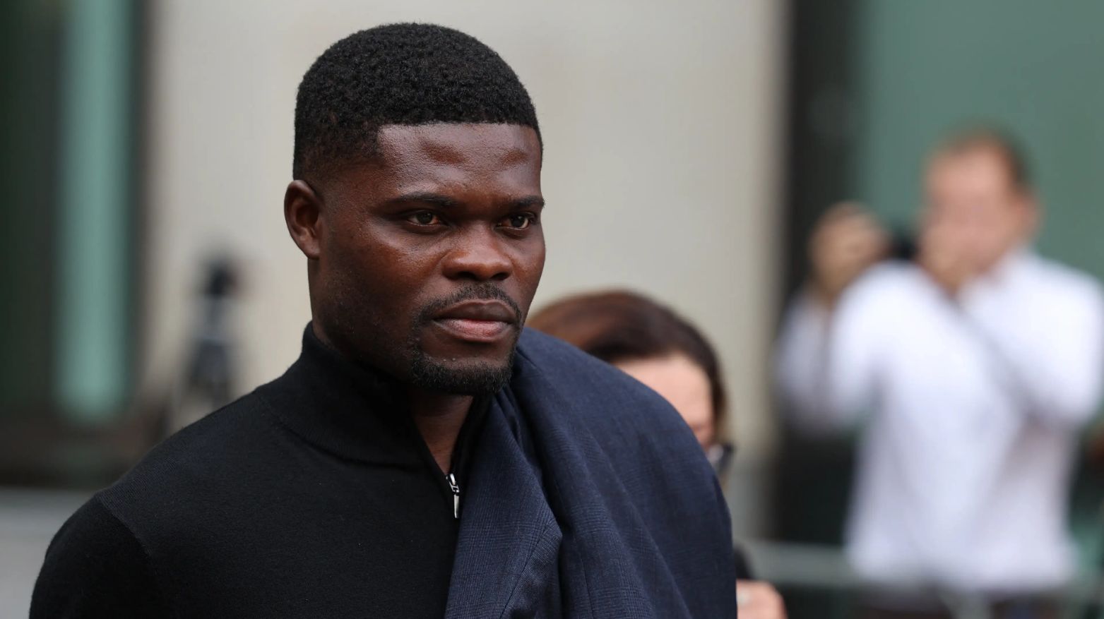 Partey exits the Crown Court.